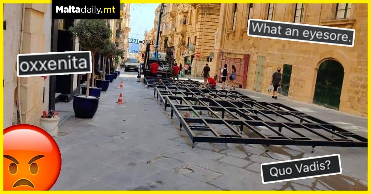 Large metal platform in Valletta Merchants Street called an obscenity