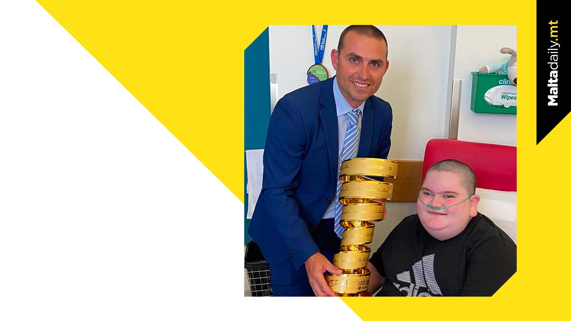 Jake Vella holds Giro d’Italia trophy in special hospital visit