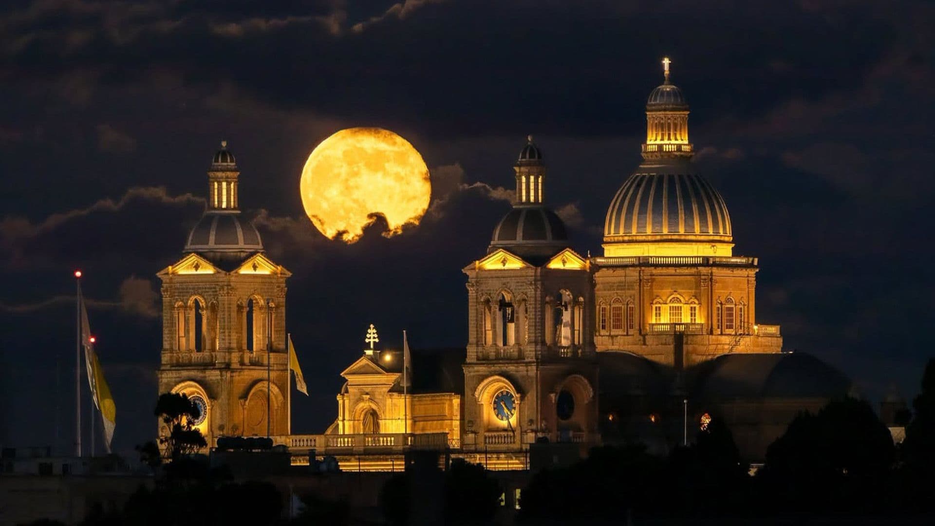 Local Photographer Captures Moon Shining Over Paola Basilica