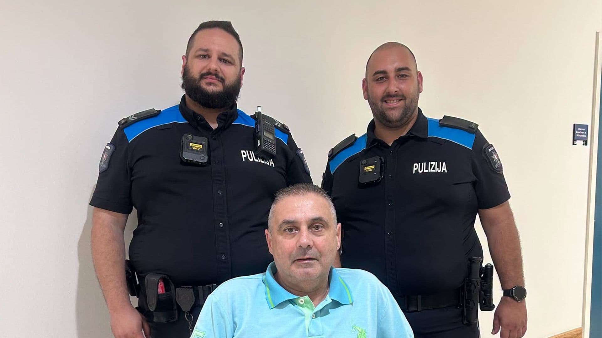 Police Reunite With Man They Rescued After Being Trapped Between A Car And A Truck