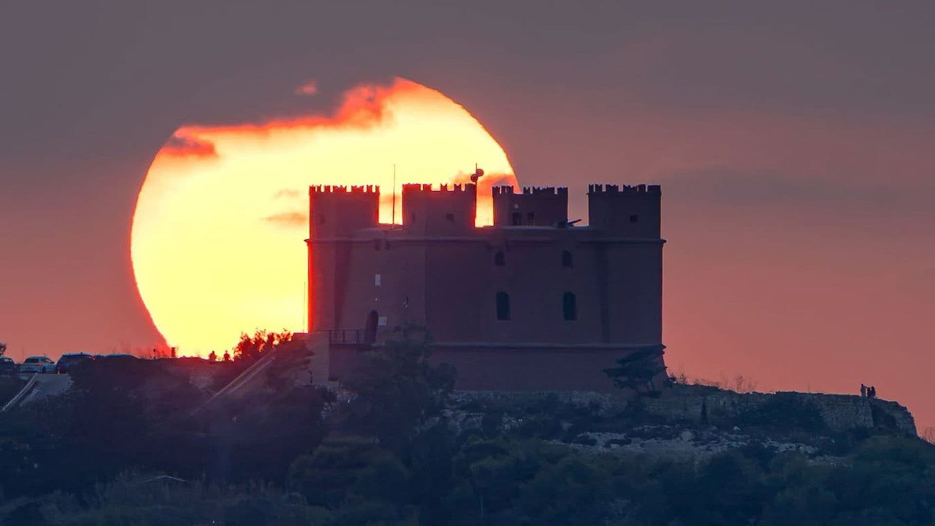 Local Photographer Captures Stunning Shot Of The Sun Setting Behind Mellieħa's Red Tower
