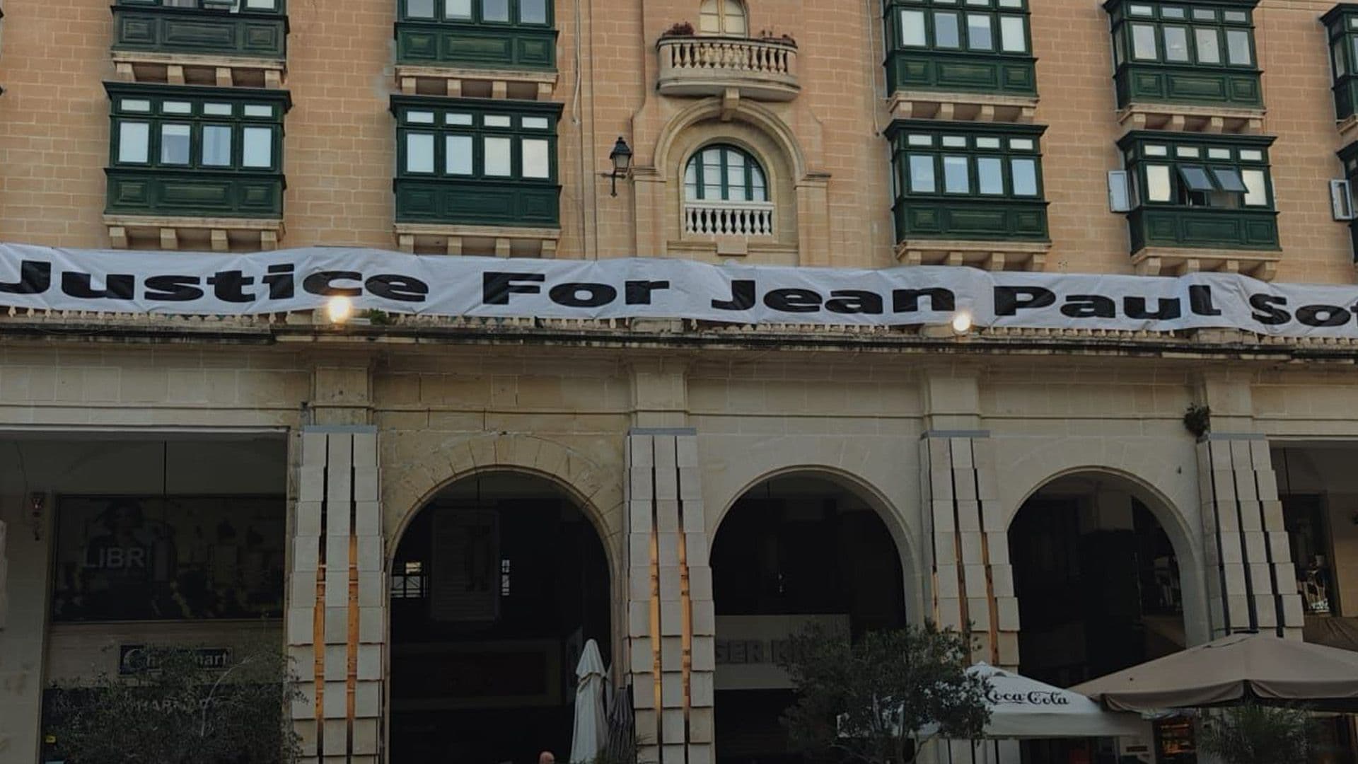 Banner for Justice Raised Again for Jean Paul Despite Recent Adverse Weather