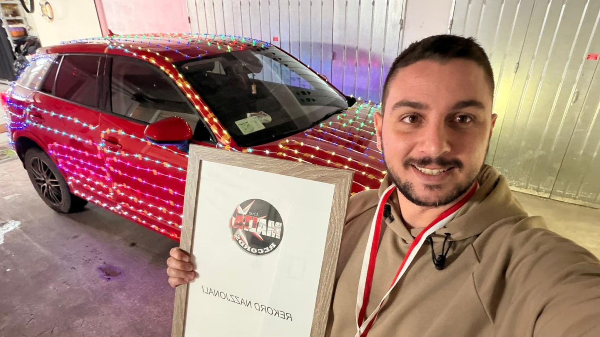 Local Breaks Record For Most Christmas Light Bulbs On His Car