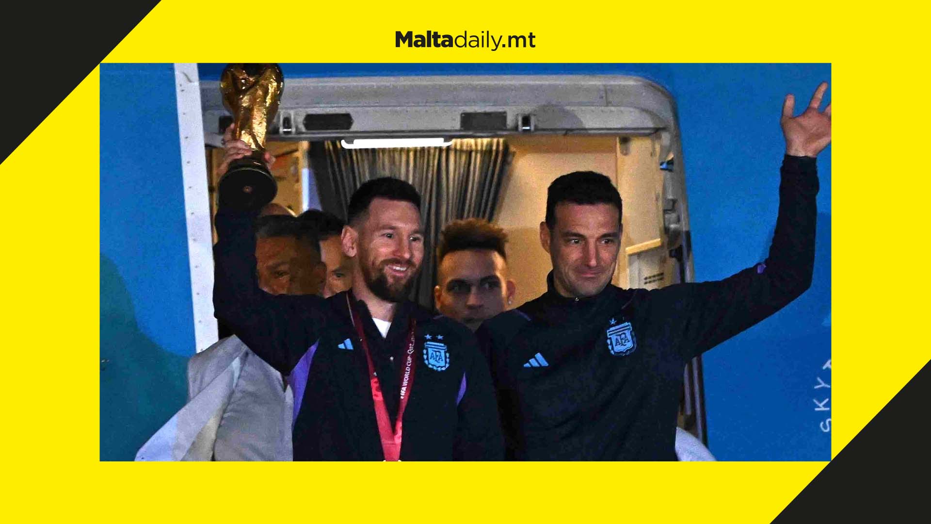 Lionel Messi arrives back in Argentina holding World Cup trophy