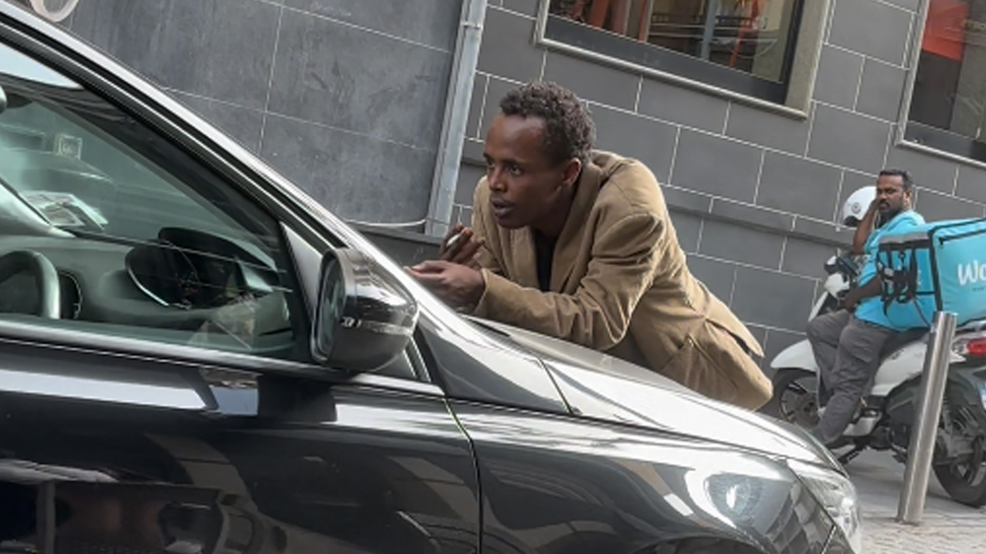 Cab Driver's Journey Halted by Smoking Man on Bonnet